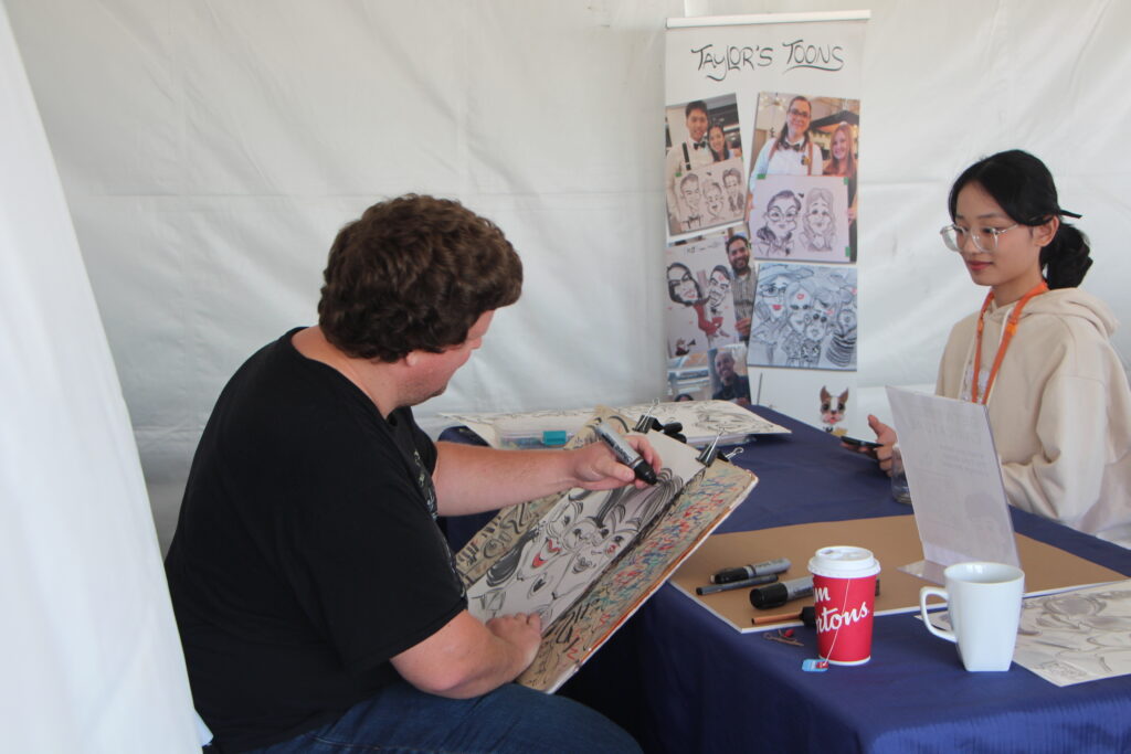 Taylor Toons Caricature Artist at the Cora Tenant Appreciation BBQ